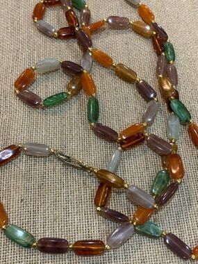 Vintage signed Hong Kong opera length necklace.  Multicolor